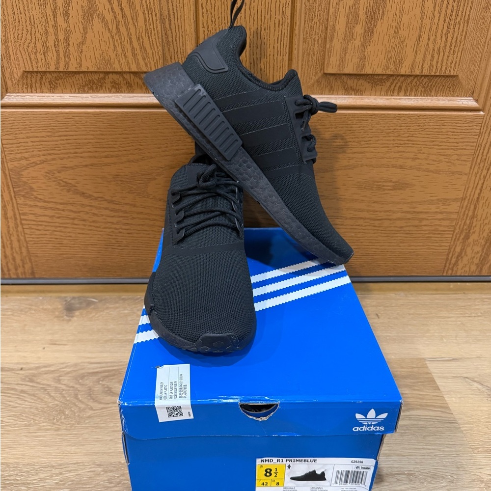 Stylish adidas NMD R1 sneakers. All Black